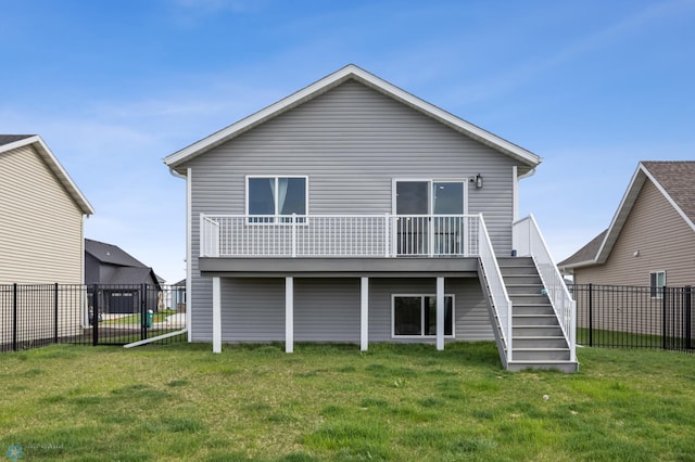 rear view of property with stairs and a wooden deck