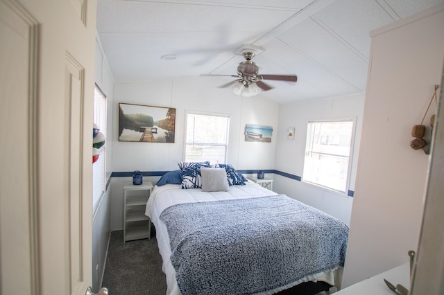 bedroom with vaulted ceiling, carpet, and ceiling fan