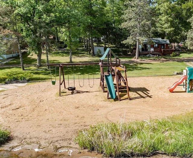 communal playground with view of scattered trees and a lawn