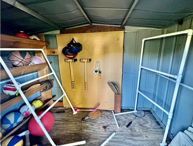workout area with wood finished floors