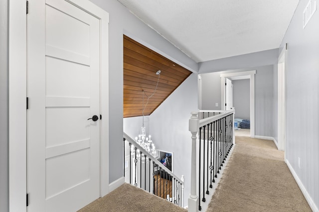 1900 Vernon Dr S, Minnetonka, MN 55305 - corridor featuring an upstairs landing, baseboards, carpet floors, a chandelier, and vaulted ceiling