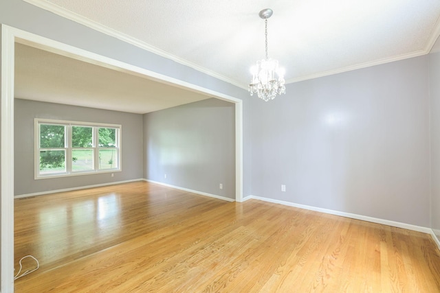 1900 Vernon Dr S, Minnetonka, MN 55305 - unfurnished room with a chandelier, light wood-type flooring, baseboards, and ornamental molding