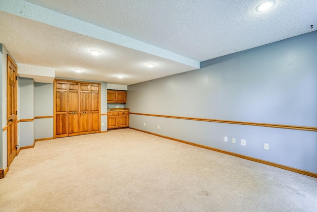 1900 Vernon Dr S, Minnetonka, MN 55305 - finished basement with baseboards, light carpet, and a textured ceiling
