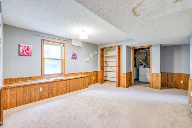 1900 Vernon Dr S, Minnetonka, MN 55305 - unfurnished bedroom with washer / clothes dryer, a wainscoted wall, wooden walls, a textured ceiling, and carpet