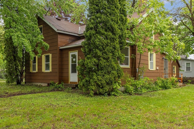 100 2nd St S, Delano, MN 55328 - view of front facade featuring a front yard