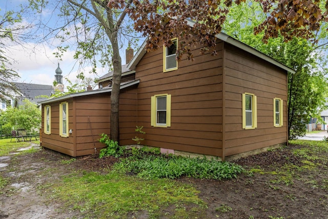 100 2nd St S, Delano, MN 55328 - view of property exterior featuring a chimney