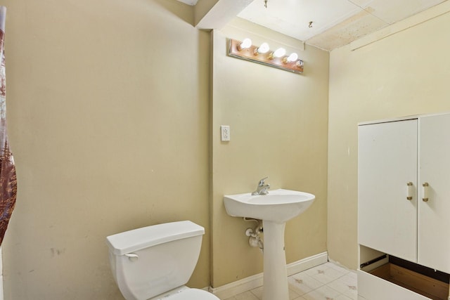 100 2nd St S, Delano, MN 55328 - half bath featuring toilet and baseboards