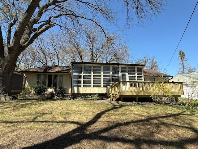 314 Burr Oak Dr, Albert Lea, MN 56007 - rear view of property with a sunroom, a wooden deck, and a lawn