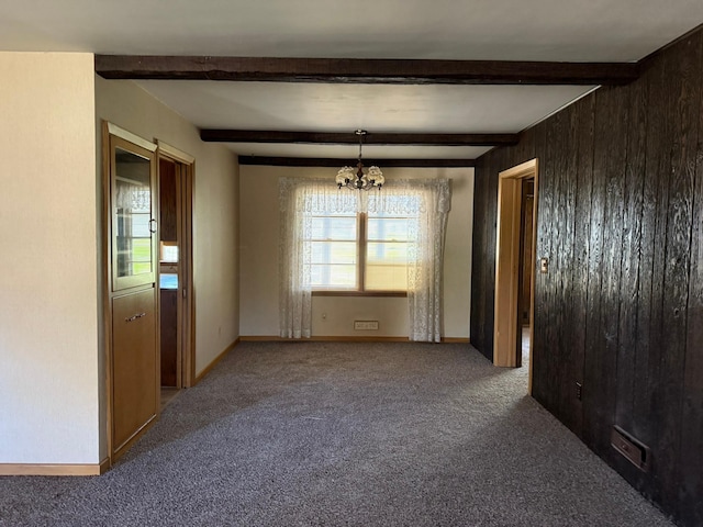 314 Burr Oak Dr, Albert Lea, MN 56007 - carpeted empty room featuring a chandelier, beamed ceiling, wooden walls, and baseboards