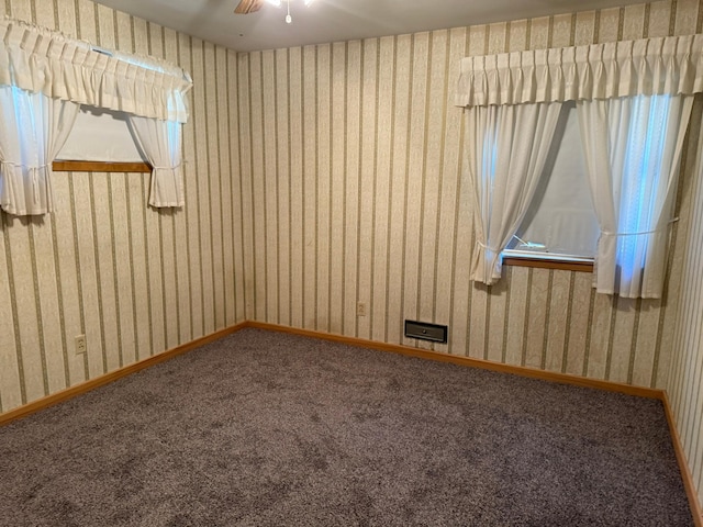 314 Burr Oak Dr, Albert Lea, MN 56007 - carpeted empty room featuring wallpapered walls and ceiling fan