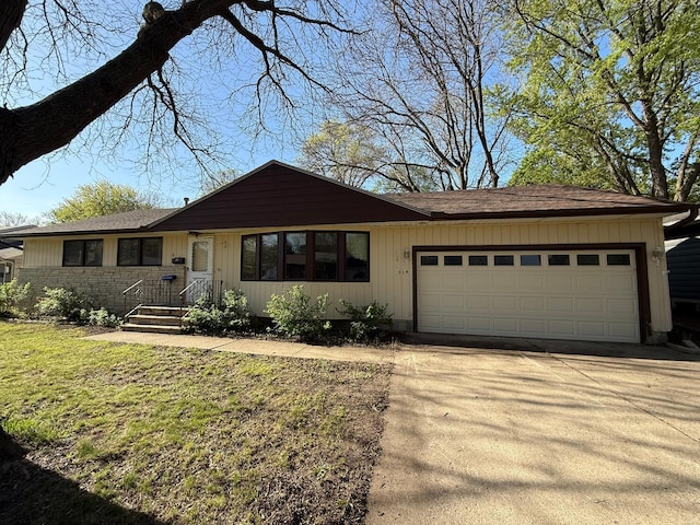 314 Burr Oak Dr, Albert Lea, MN 56007 - ranch-style house featuring a garage, concrete driveway, a front lawn, and roof with shingles