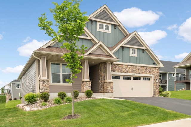 20109 Geneva Trl, Lakeville, MN 55044 - craftsman inspired home featuring board and batten siding, driveway, stone siding, and a front lawn
