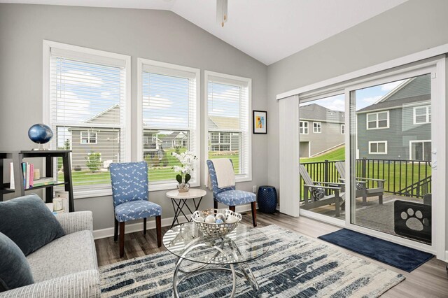 20109 Geneva Trl, Lakeville, MN 55044 - living area featuring wood finished floors, vaulted ceiling, ceiling fan, and baseboards