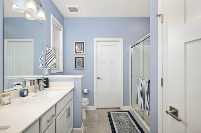 20109 Geneva Trl, Lakeville, MN 55044 - bathroom with double vanity, toilet, a stall shower, tile patterned flooring, and baseboards