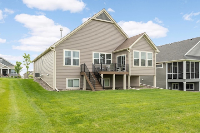 20109 Geneva Trl, Lakeville, MN 55044 - rear view of property featuring stairway, a deck, a lawn, and central AC