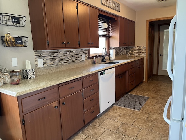 2250 18th Ave, Windom, MN 56101 - kitchen with white appliances, decorative backsplash, and light countertops