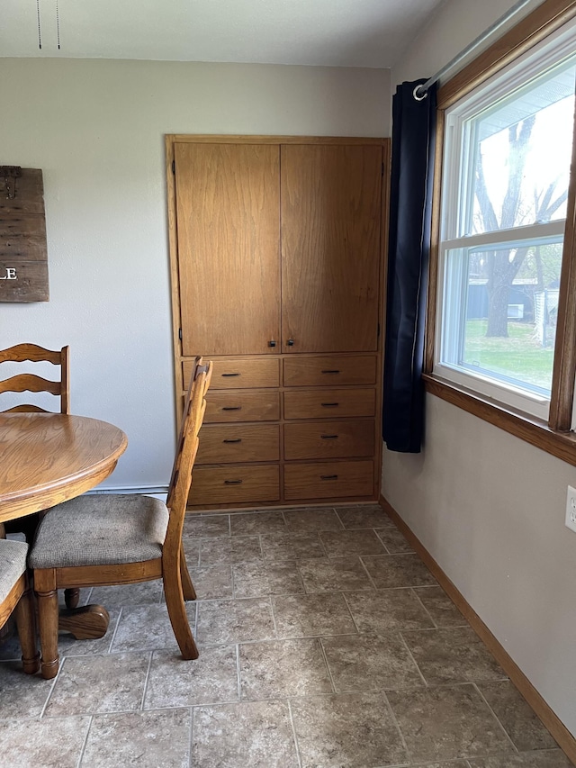2250 18th Ave, Windom, MN 56101 - dining area featuring baseboards and stone finish floors