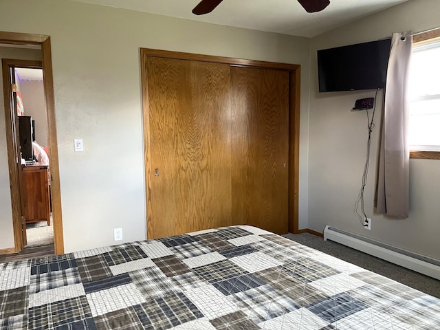 2250 18th Ave, Windom, MN 56101 - unfurnished bedroom featuring a closet, baseboard heating, and a ceiling fan