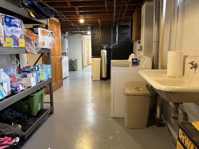 2250 18th Ave, Windom, MN 56101 - unfinished basement featuring separate washer and dryer, a water softener system, and water heater