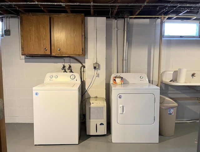 2250 18th Ave, Windom, MN 56101 - laundry area with washing machine and dryer and cabinet space