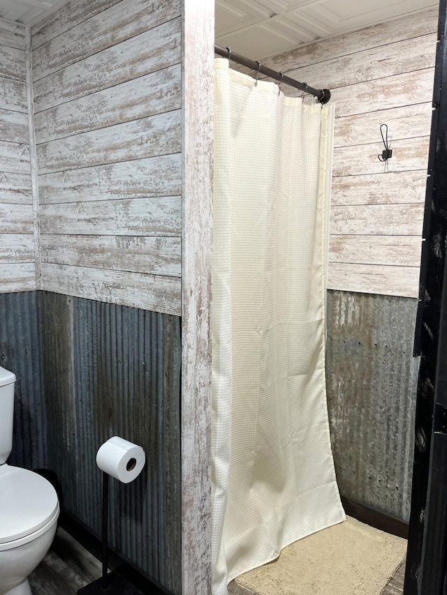 2250 18th Ave, Windom, MN 56101 - bathroom featuring wood walls and a shower with curtain