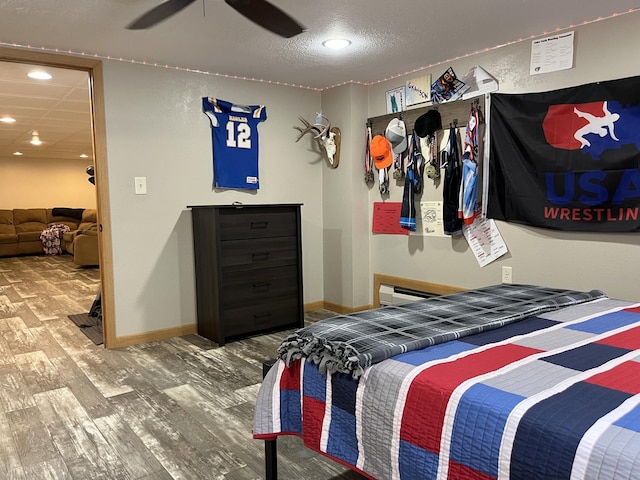2250 18th Ave, Windom, MN 56101 - bedroom featuring wood finished floors, recessed lighting, a textured ceiling, and a ceiling fan