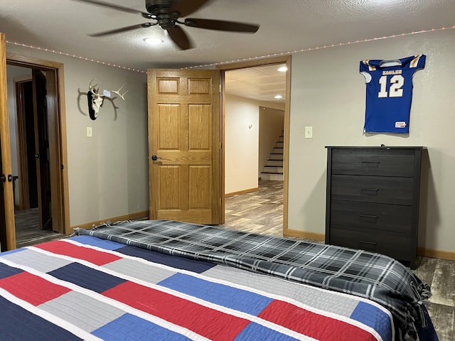 2250 18th Ave, Windom, MN 56101 - bedroom featuring wood finished floors and a ceiling fan