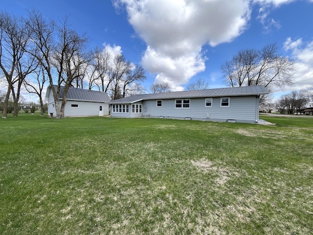 2250 18th Ave, Windom, MN 56101 - rear view of property featuring a metal roof and a yard