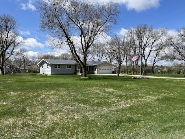 2250 18th Ave, Windom, MN 56101 - view of grassy yard featuring an attached garage
