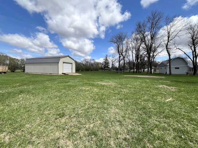 2250 18th Ave, Windom, MN 56101 - view of grassy yard with an outdoor structure and a detached garage
