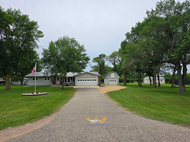 2250 18th Ave, Windom, MN 56101 - view of front facade featuring a front yard, a detached garage, and a metal roof
