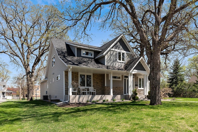 204 8th Ave S, Princeton, MN 55371 - craftsman-style house with stone siding, a front lawn, and a porch