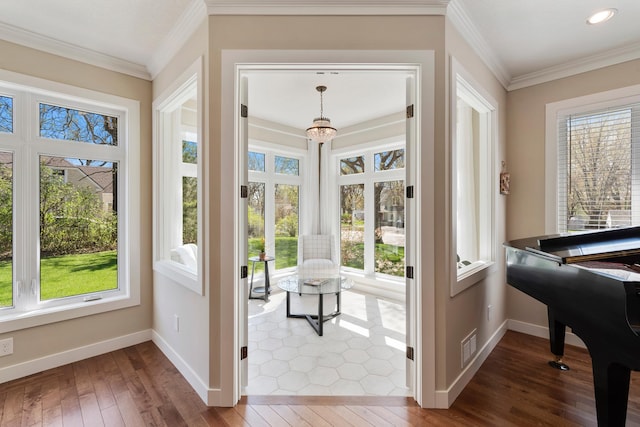 204 8th Ave S, Princeton, MN 55371 - doorway to outside featuring wood-type flooring, ornamental molding, a chandelier, and recessed lighting