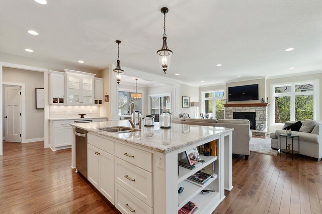 204 8th Ave S, Princeton, MN 55371 - kitchen featuring stainless steel dishwasher, healthy amount of natural light, hardwood / wood-style floors, a kitchen island with sink, and recessed lighting