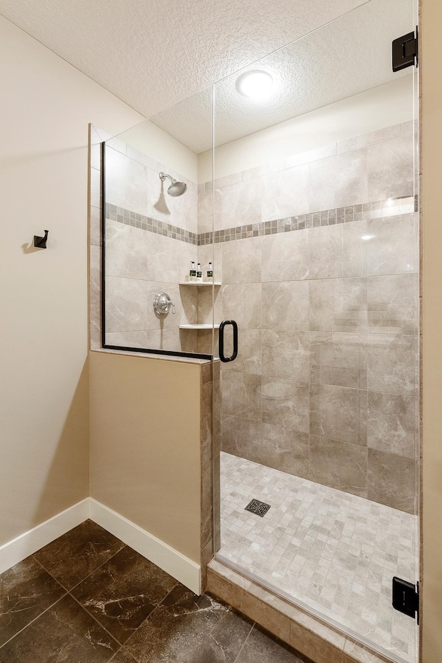 204 8th Ave S, Princeton, MN 55371 - full bathroom with a shower stall, a textured ceiling, and marble look tiles