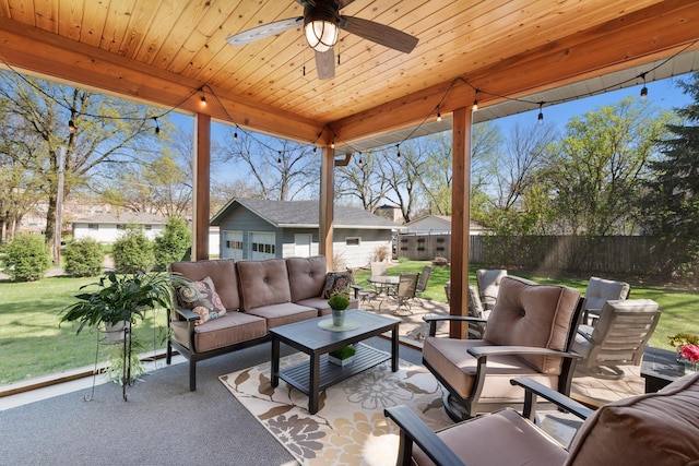 204 8th Ave S, Princeton, MN 55371 - fenced backyard with an outdoor living space, a patio area, an outbuilding, and a ceiling fan