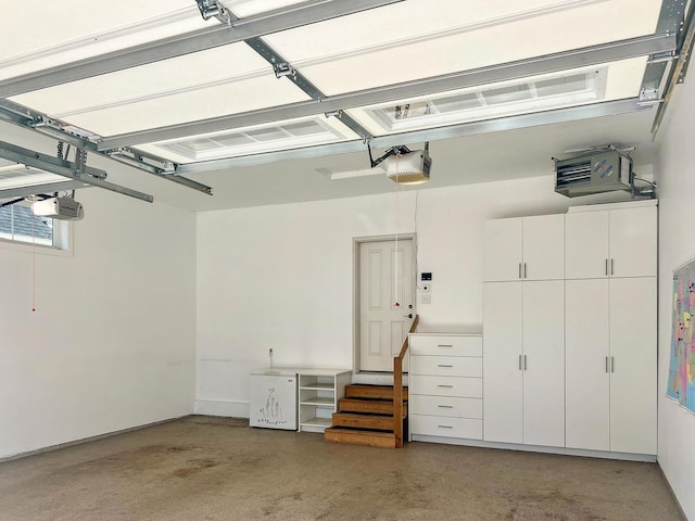 204 8th Ave S, Princeton, MN 55371 - garage with a garage door opener and a heating unit