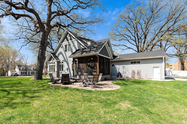 204 8th Ave S, Princeton, MN 55371 - back of property with a patio, a sunroom, and a lawn