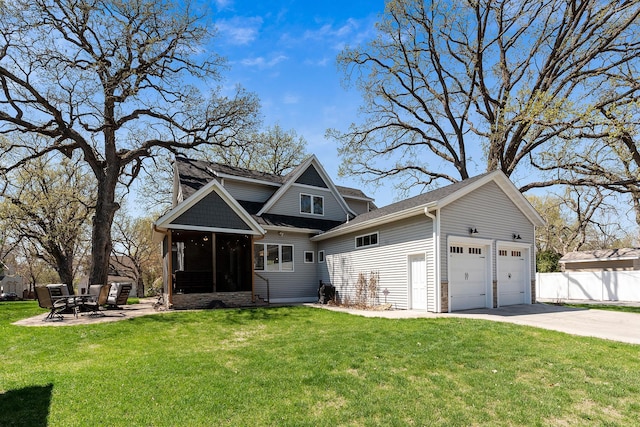 204 8th Ave S, Princeton, MN 55371 - back of property featuring an attached garage, concrete driveway, roof with shingles, and a sunroom