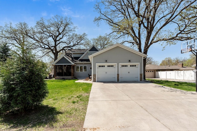 204 8th Ave S, Princeton, MN 55371 - view of front of home with a garage, a sunroom, and driveway