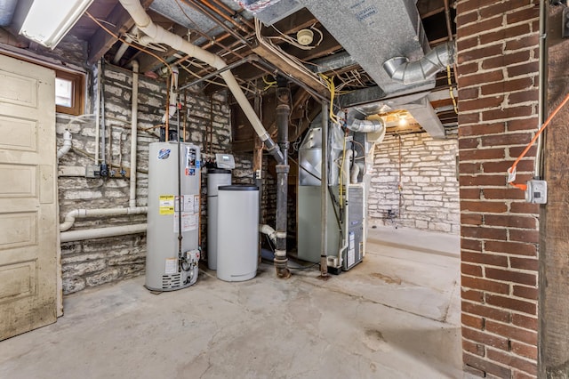 below grade area featuring water heater and heating unit