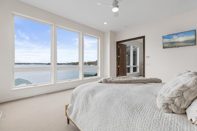 4919 Three Points Blvd, Mound, MN 55364 - bedroom featuring a water view, ceiling fan, carpet flooring, and recessed lighting