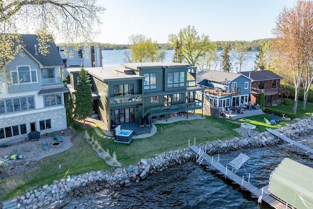 4919 Three Points Blvd, Mound, MN 55364 - rear view of house featuring a balcony, a water view, a yard, and a patio
