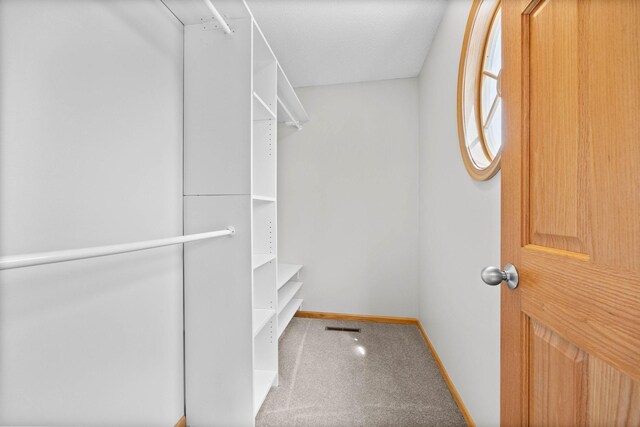 walk in closet with visible vents