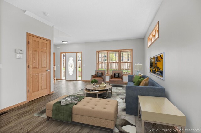 living room featuring baseboards and wood finished floors