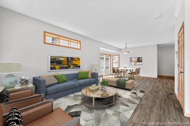 living room with wood finished floors and baseboards