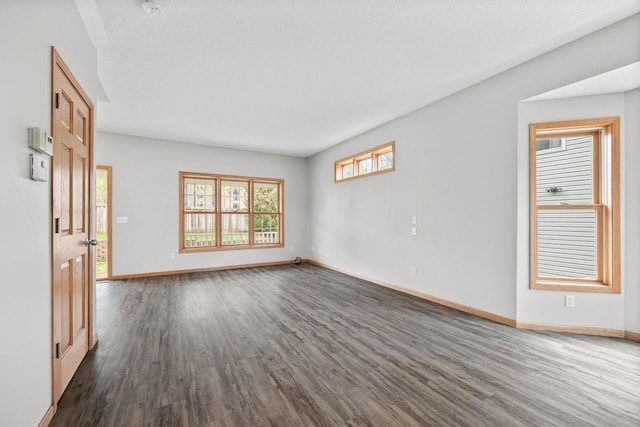 3014 39th St, Minneapolis, MN 55406 - unfurnished living room featuring dark wood finished floors and baseboards