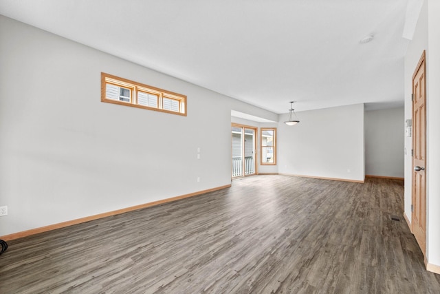 3014 39th St, Minneapolis, MN 55406 - unfurnished living room featuring wood finished floors and baseboards