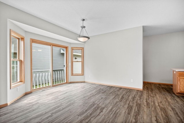 3014 39th St, Minneapolis, MN 55406 - unfurnished dining area featuring wood finished floors and baseboards
