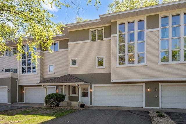 3664 Abbey Way Unit C, Eagan, MN 55123 - townhome / multi-family property with stucco siding, a garage, and driveway